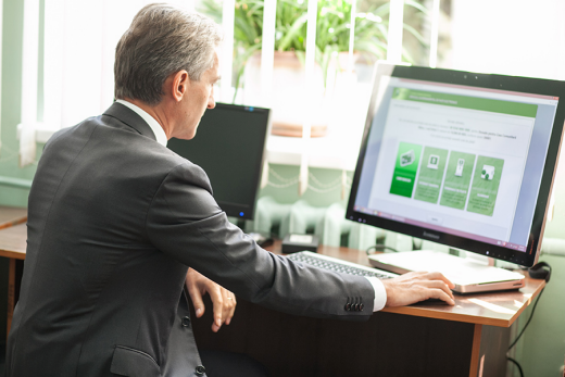 Prime-Minister Iurie Leanca navigates the Moldova mpay website which allows citizens to pay online for a wide range of public services